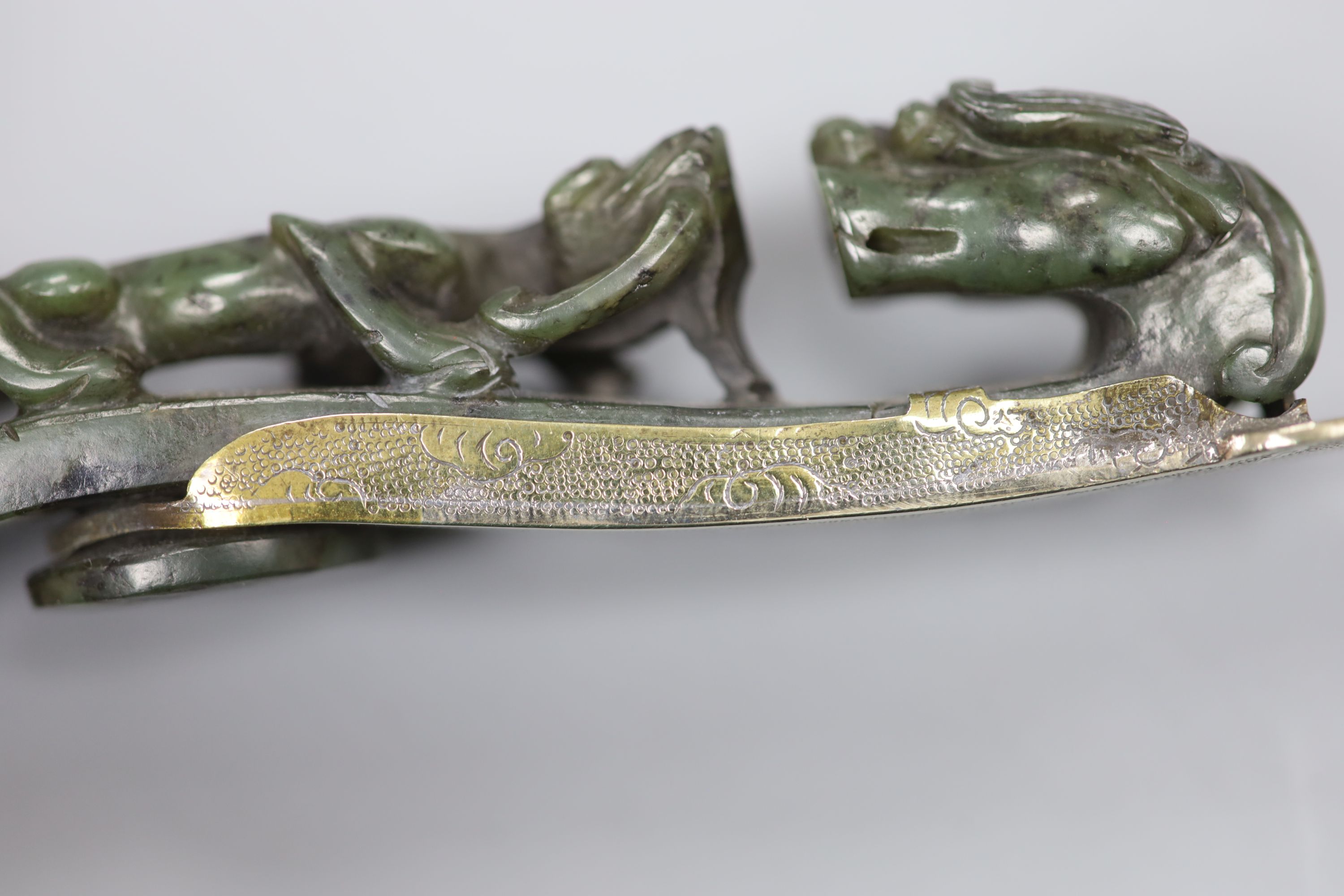 An 18th/19th century Chinese spinach green jadeite dragon belt hook, mounted as the handle for a paperknife, length 32cm